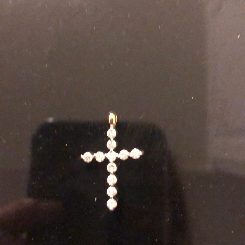 Approx 1/2 ct diamond cross 14k stamped